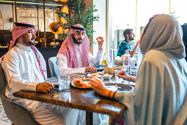 istock Arab Individuals Conversing Over Meal in Upscale Dining Spot 2254073038