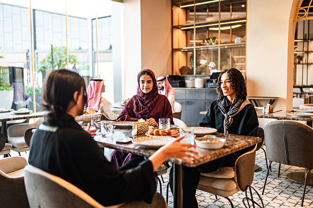 istock Conversation Among Arab Women at Stylish Restaurant Table 2254073061