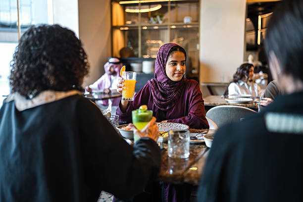 istock Young Arab Women Engaging in Conversation Over Refreshments 2254073068
