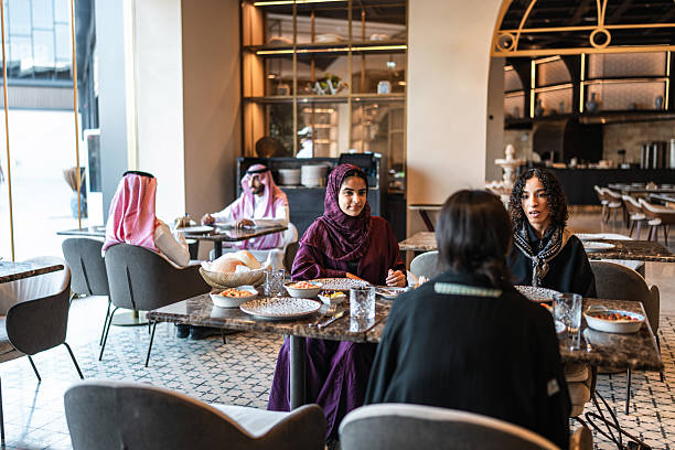 istock Dining Experience with Arab Women in Stylish Restaurant Setting 2254073073