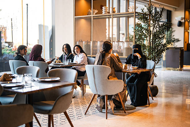 istock Lively Conversation Among Young Middle Eastern Women at Elegant Venue 2254073144