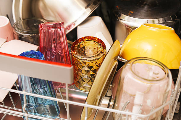 Modern kitchen appliance in use. Domestic cleaning process. Daily household task