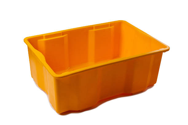 Bright orange plastic storage box isolated on a clean white background. The durable container is empty, clean, and ready for use in organization, industry, or retail.