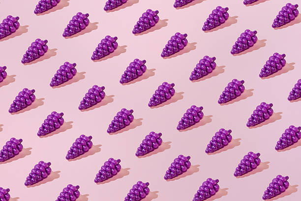 istock Creative summer grape pattern flat lay on pastel pink background minimalism 2254077037