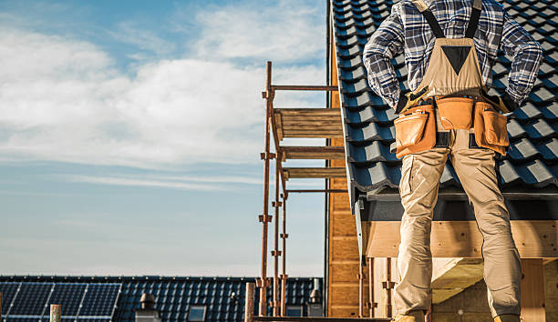 istock Construction Worker on a Roof Looking Over Building Site in Daylight 2254077749