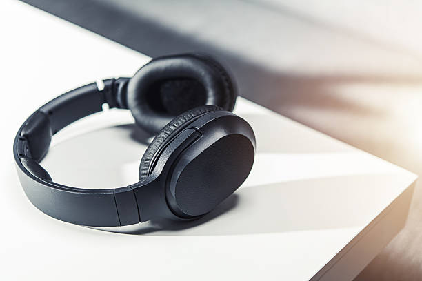 Black Headphones on a Table With Soft Light in a Modern Space