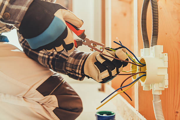 istock Electrician Works on Wiring Inside a Building During Renovation Tasks 2254079123