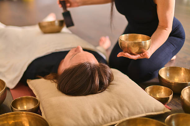 istock Sound healing with singing bowls in tranquil setting 2254080772