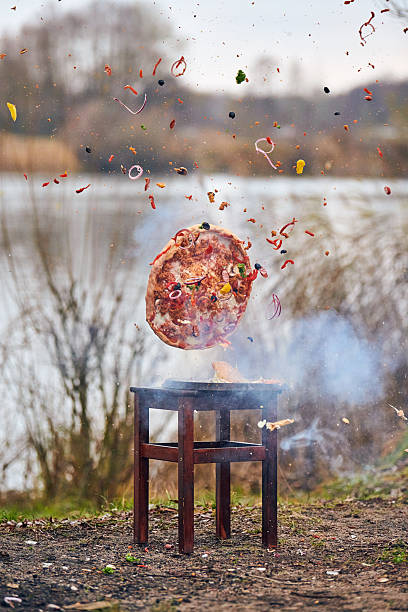Pizza explosion by scenic lake captures chaotic food splash