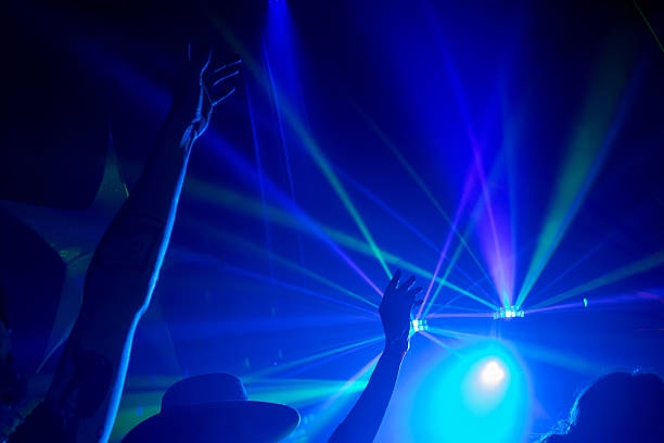 Silhouets of a people dandin in a nightclub