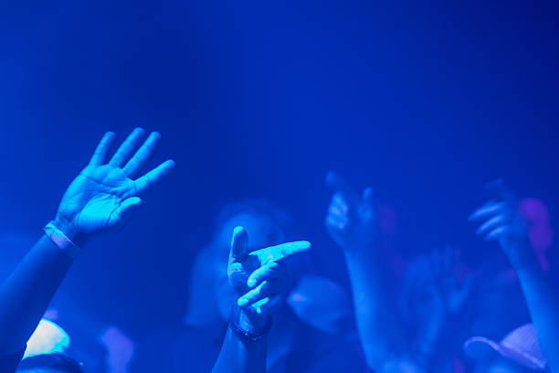 Dancing crowd and lights at a music event