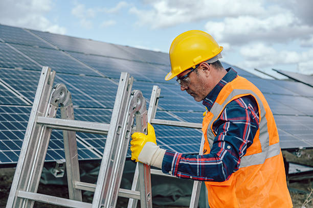 istock Solar Energy Technician Installing Ladder at Solar Power Plant Site 2254084835