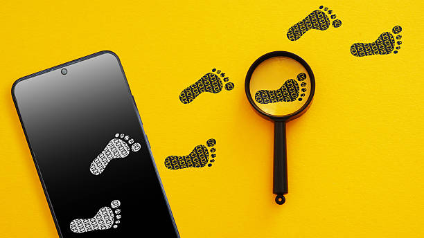 Digital Footprint Tracking Concept - Smartphone with Footprints and Magnifying Glass. Online Privacy, User Data Monitoring and Cyber Security