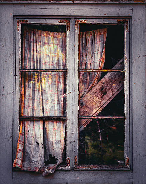 istock Broken Old Window with Cracked Glass and Weathered Frame 2254088562