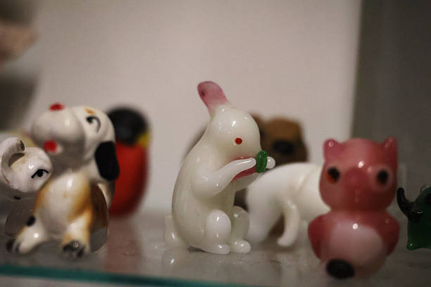 istock A white porcelain bunny with red eyes eating a carrot 2254090509