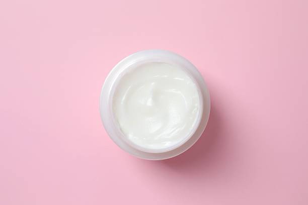 istock Jar of body cream on pink background 2254092800