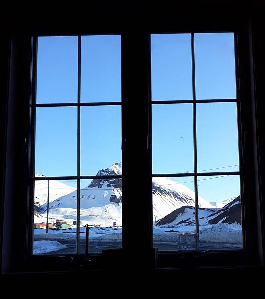 istock View on the surrounding landscape from a window in Longyearbyen. 2254093285