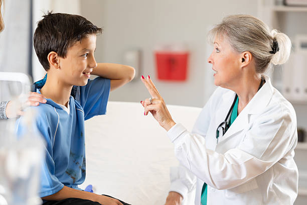 istock Doctor performs vision test on young boy, showing concern and professional guidance in exam room. 2254094359