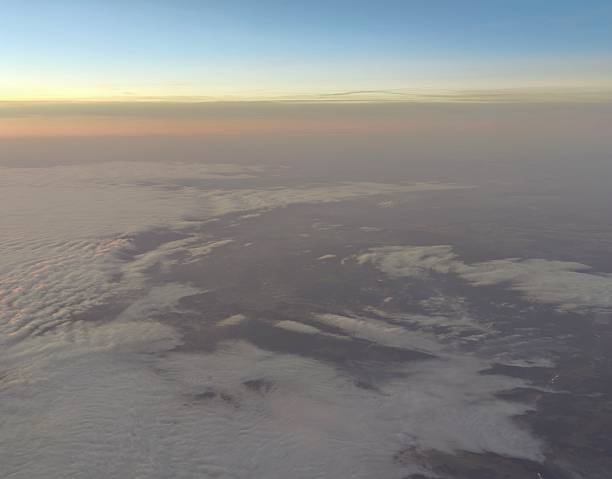 istock Aerial view of swirling cloud system above rough terrain highlighting atmospheric activity and contrast 2254099253