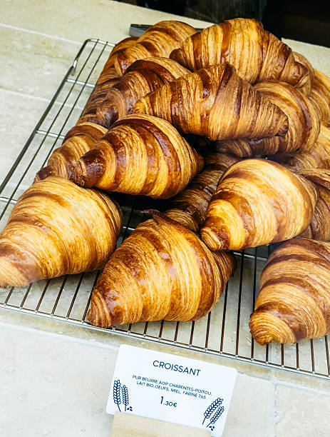 istock Freshly Baked Croissants on a Wire Rack 2254101075