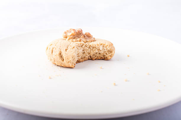 Homemade cookie with a walnut in the middle.
