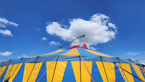 istock Circus tent against blue sky with clouds 2254102005