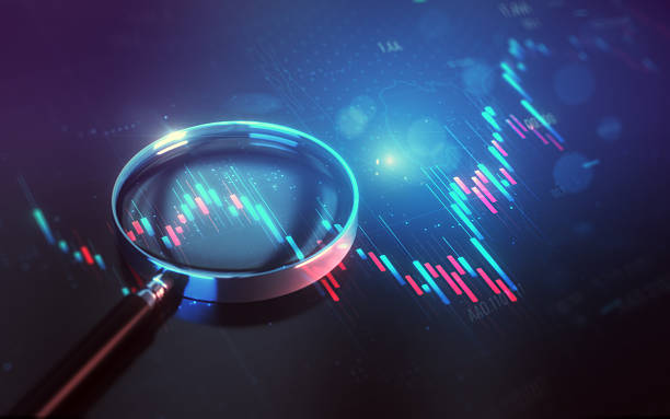istock Magnifying Glass on Blue Red Financial Chart Background 2254102779