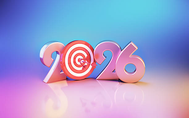 istock New Year 2026 and Target Board Sitting on Soft Blue Pink Orange Background 2254102901