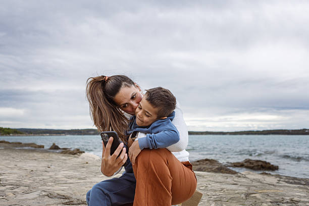 istock Family Beach Selfie 2254103798