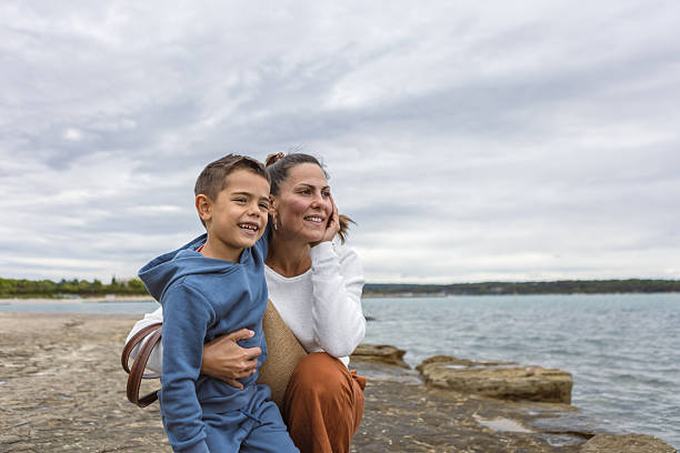 istock Happy Mother and Son by the Lakeside 2254103876