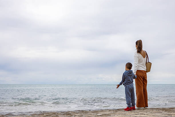 istock Peaceful Beach Stroll with Family 2254103888