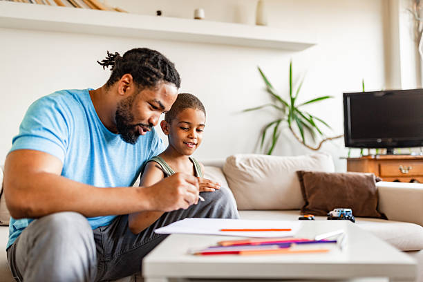 istock Father and Child Drawing Together at Home 2254104041
