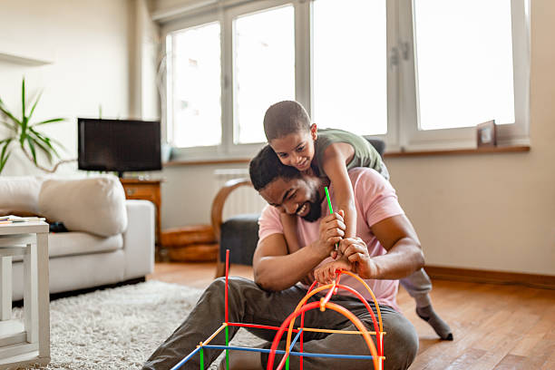 istock Father and Son Playing Together at Home 2254104051