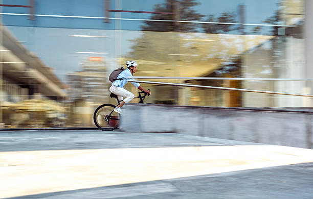smartly dressed young man on unicycle