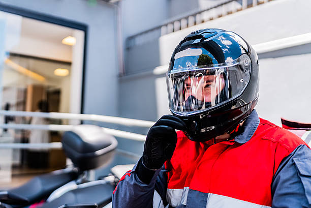 Rescue worker man riding a motorcycle outdoors