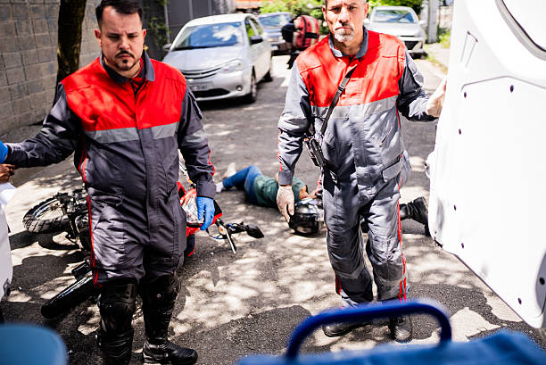 istock Paramedics retrieving a stretcher to assist an accident victim 2254105012