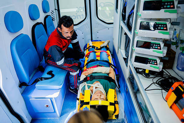 istock Paramedics attending a accident victim at ambulance 2254105083