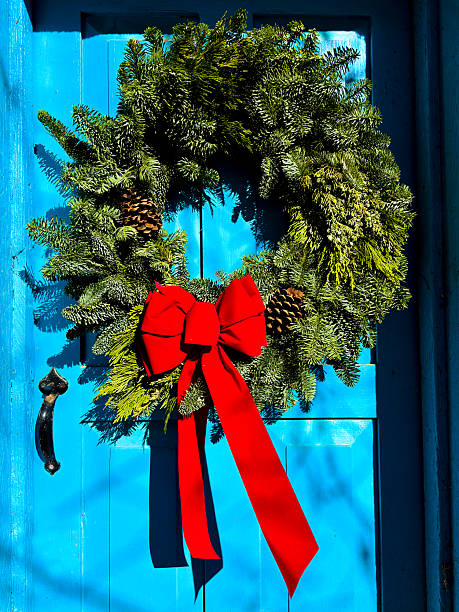 Santa Fe Style: Sunlit Green Christmas Wreath on Blue Door