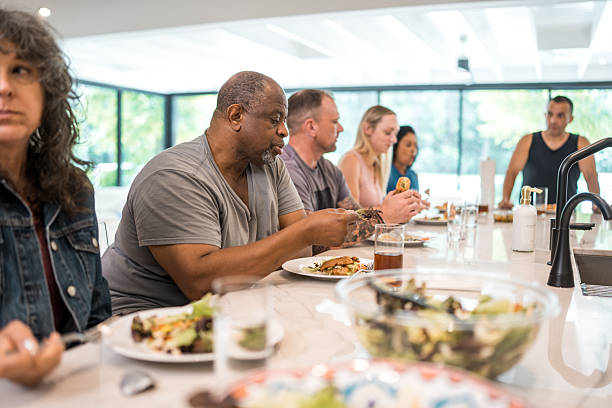 istock Diverse Group in Rehabilitation Enjoying Communal Dining 2254106639