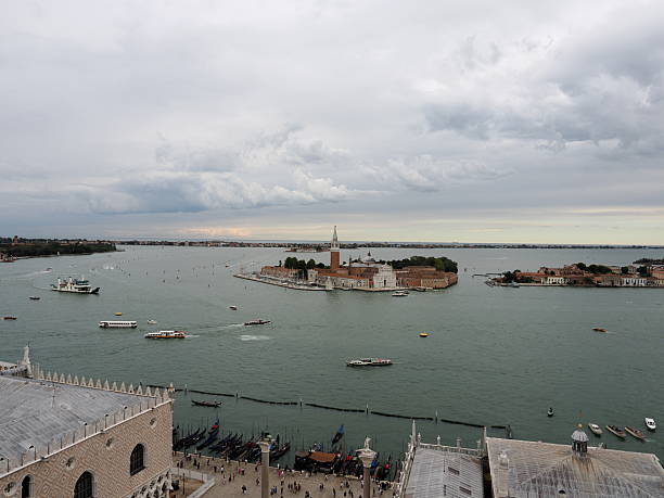 View of Saint Mark's Campanile and Saint Mark's Basilica at San Giorgio Maggiore island against clear sky seen through ship window at Venice,Italy