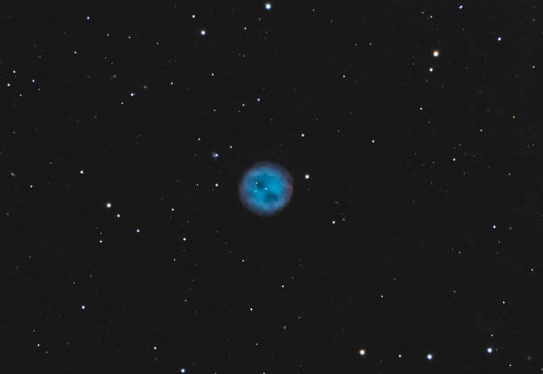 Detailed view of the Owl Nebula (M97, NGC 3587). This deep sky capture reveals the striking blue planetary nebula with its distinct dark \