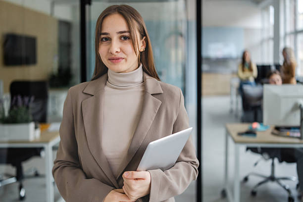 istock Businesswoman in office engaging with colleagues on collaborative project in modern workspace 2254110082