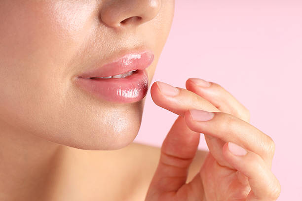 istock Woman with beautiful lips on pink background, macro view 2254112413