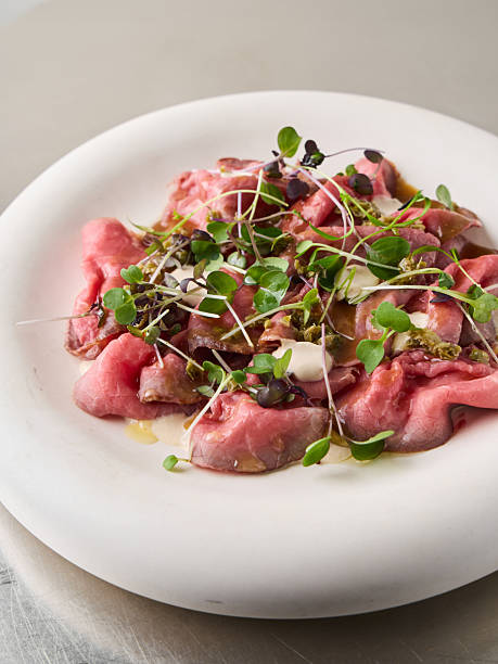 istock Delicious meat dish with herbs and toppings in a restaurant setting 2254112628