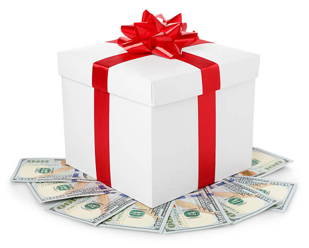 istock Gift box with dollar banknotes isolated on white 2254112755