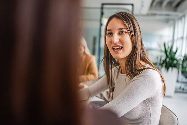 istock Businesswomen collaborate in modern office setting during work meeting with focus on teamwork and innovation 2254114936