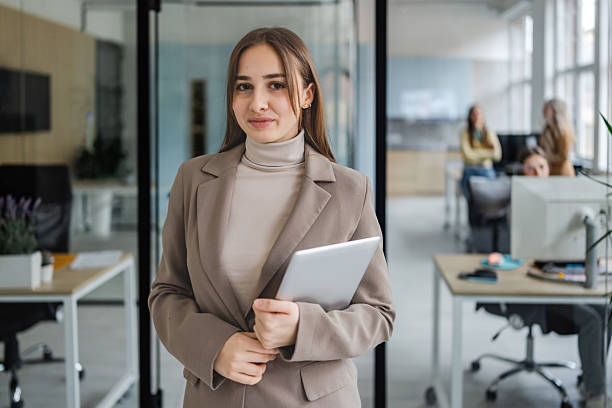 istock Businesswomen collaborating in a modern office space while showcasing teamwork in a professional environment 2254115786