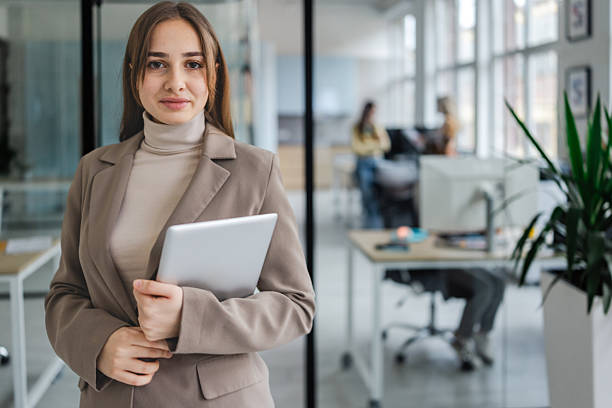 istock Women working together in an office environment with modern technology and a focus on teamwork 2254118764