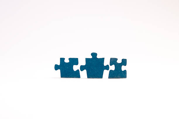 Puzzle piece with seemingly open arms flanked on both sides by other harmoniously shaped puzzle pieces