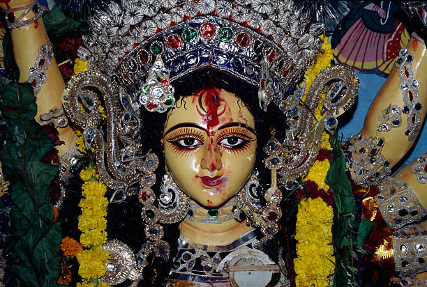 Durga Puja is a major Hindu festival, especially prominent in West Bengal, celebrating Goddess Durga's victory over the demon Mahishasura, symbolizing good over evil, featuring grand pandals (temporary shrines) with idols of the goddess and her divine family, cultural events, traditional food, and community gatherings, culminating in the immersion of idols on Vijay Dashami (Dussehra). It's a vibrant autumn festival, often occurring in September/October, recognized by UNESCO.